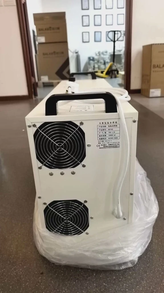 Factory specification plate of HHO flame generator showing 700 L/H capacity and CE certification