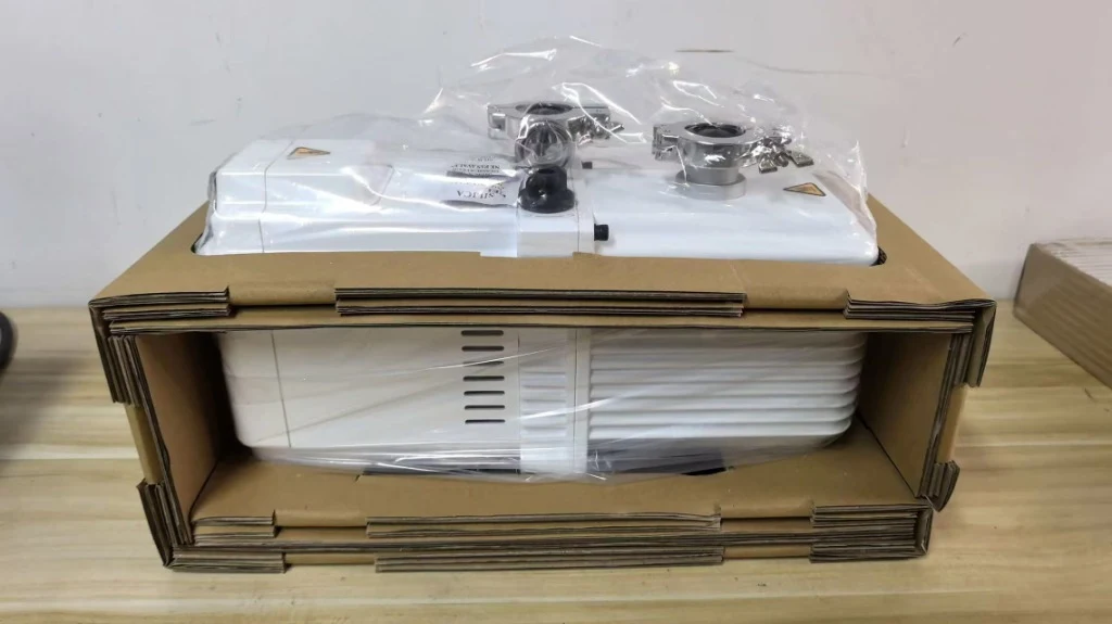 Precision dual-stage rotary vacuum pump and KF vacuum clamps packaged for overseas shipment to NYUAD